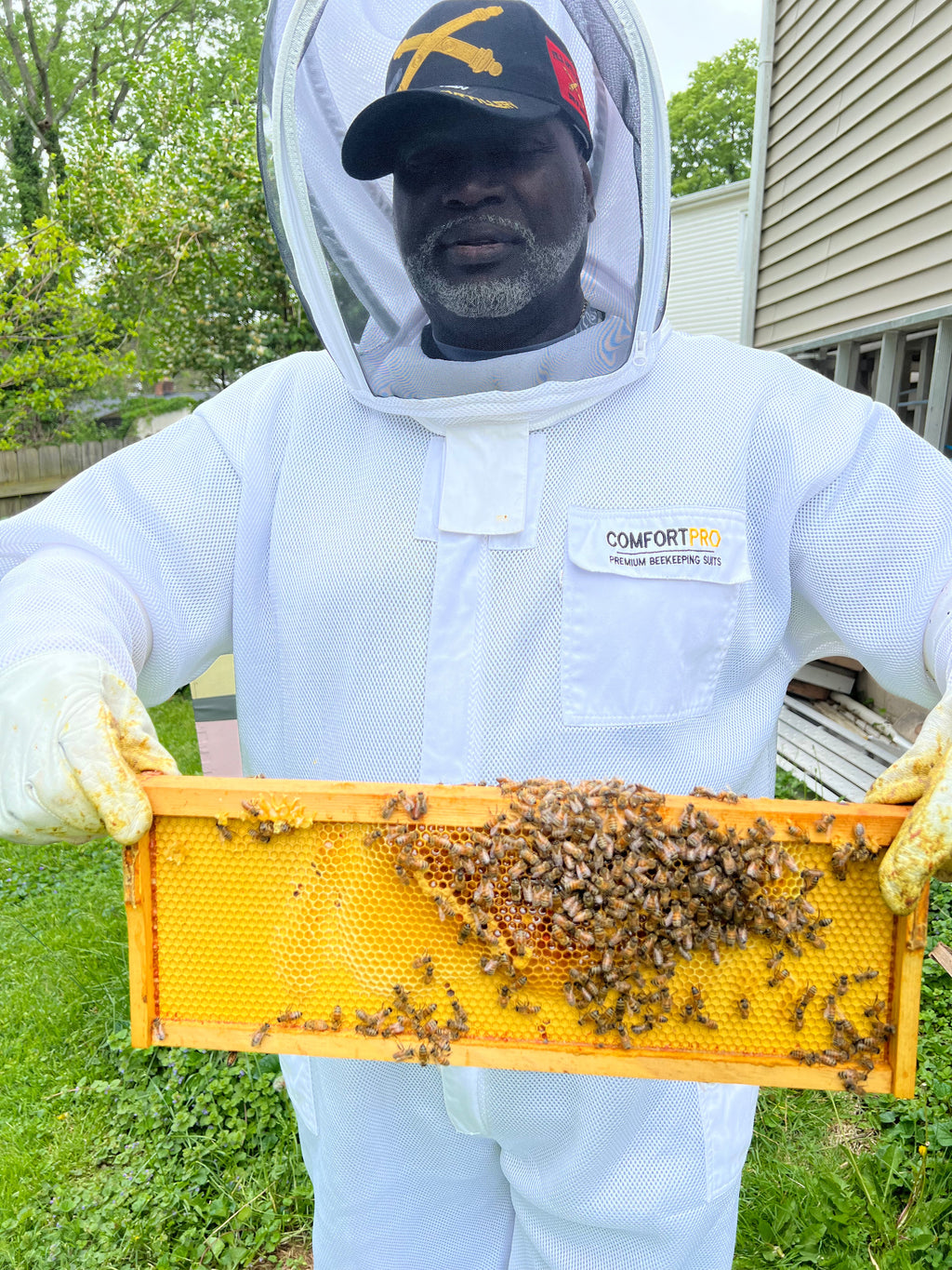 Barley Moon Botanicals therapeutic hive experience with beekeepers in protective white suits tending to honey bees