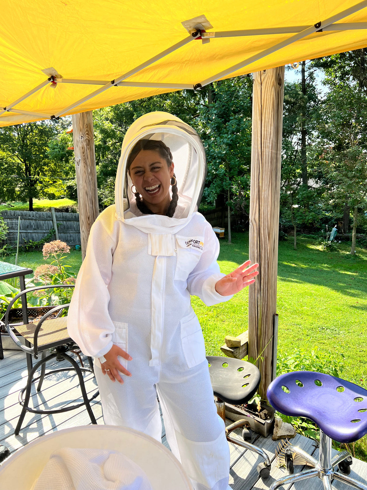 Barley Moon Botanicals therapeutic hive experience with beekeepers in protective white suits tending to honey bees