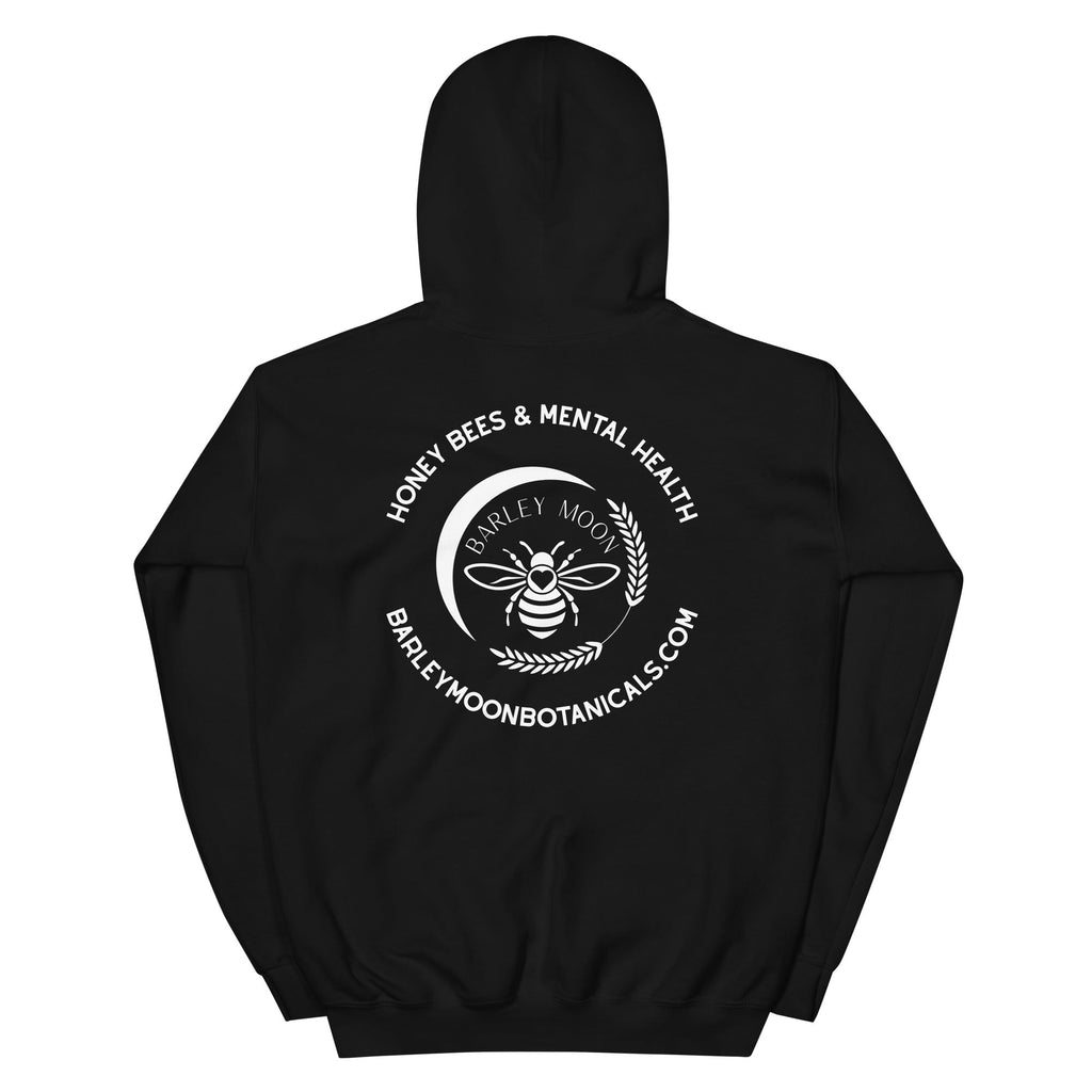 Back view of a black Barley Moon Botanicals unisex hoodie featuring a white bee and crescent moon logo graphic.
