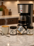 Barley Moon Botanicals Coffee Lover Bundle featuring three jars of creamed honey next to a coffee maker and mug.