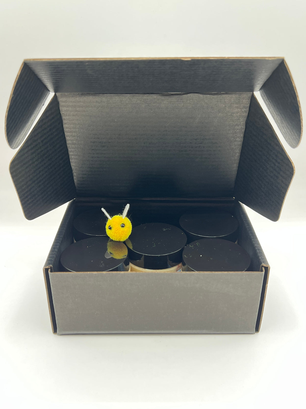 Barley Moon Botanicals Autumn Indulgence creamed honey flight set in a black gift box with a small felt bee decoration
