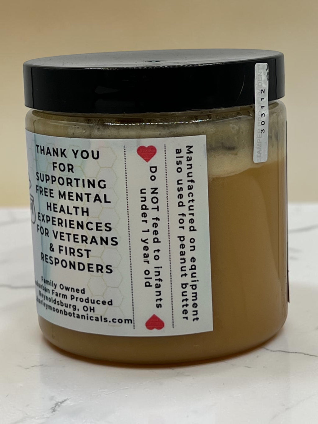 Barley Moon Botanicals Just Creamy original creamed honey jar with label detailing support for veterans and responders