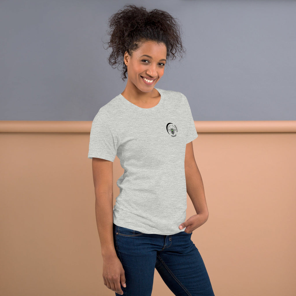 Woman wearing a Barley Moon Botanicals heather grey cotton t-shirt with a small black bee and crescent moon logo