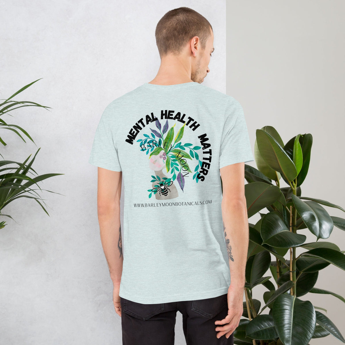 Barley Moon Botanicals unisex t-shirt in light blue with Mental Health Matters botanical bee graphic on the back