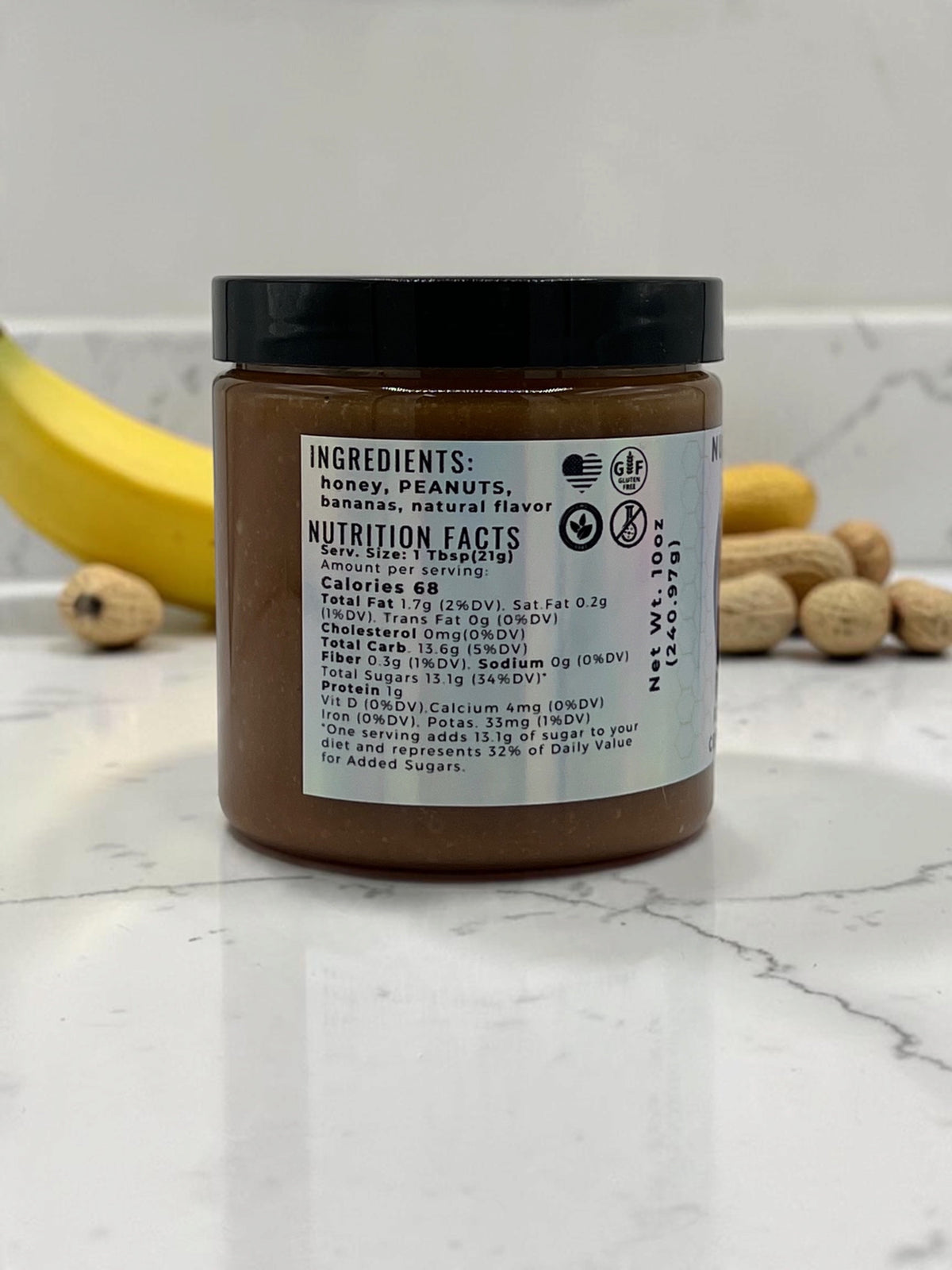 Barley Moon Botanicals Nutty Nana peanut butter banana creamed honey jar showing nutrition facts label