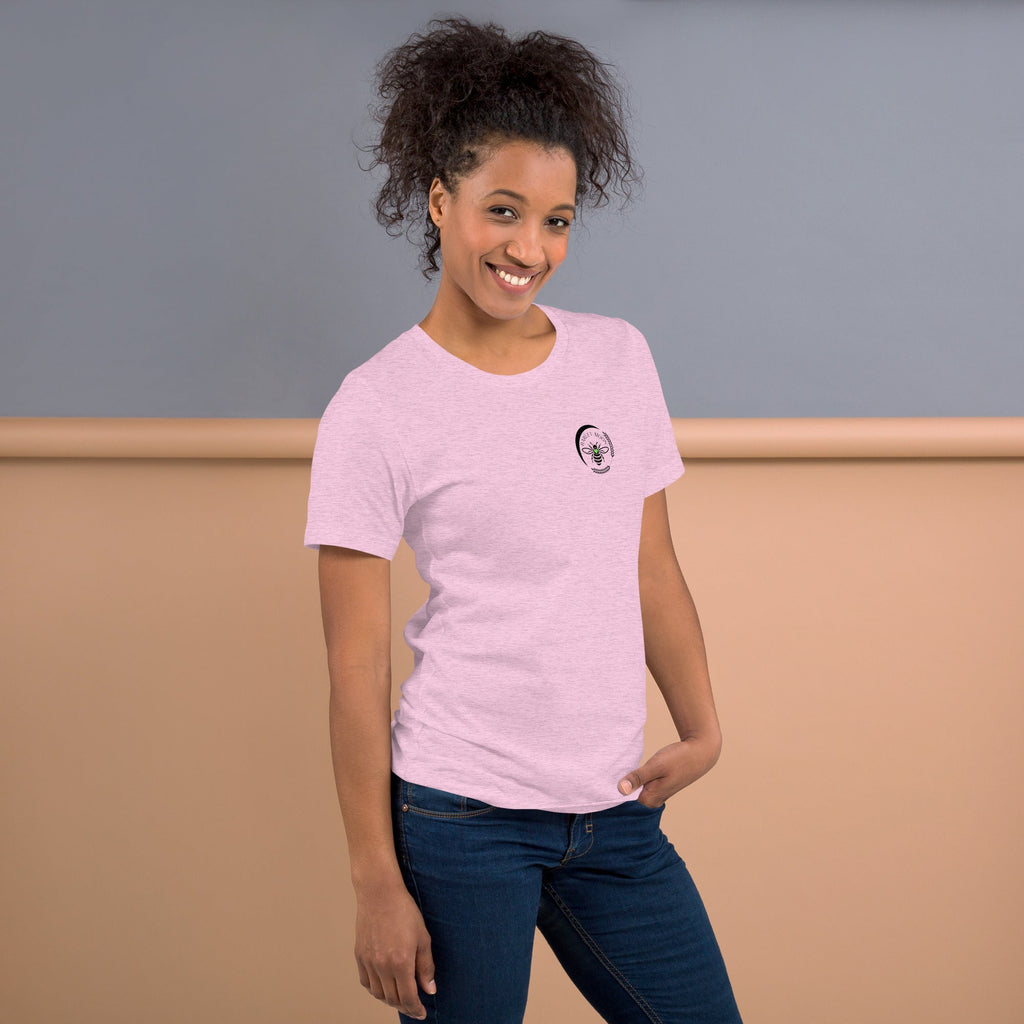 Barley Moon Botanicals light pink t-shirt with a small black bee and crescent moon logo on a smiling woman