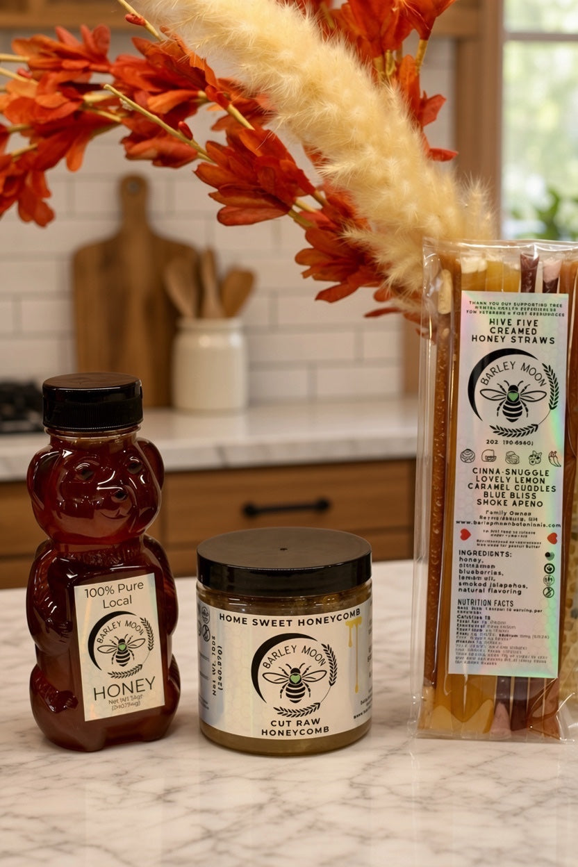 Barley Moon Botanicals raw honey bundle featuring a honey bear, jar of raw honeycomb, and creamed honey straws.