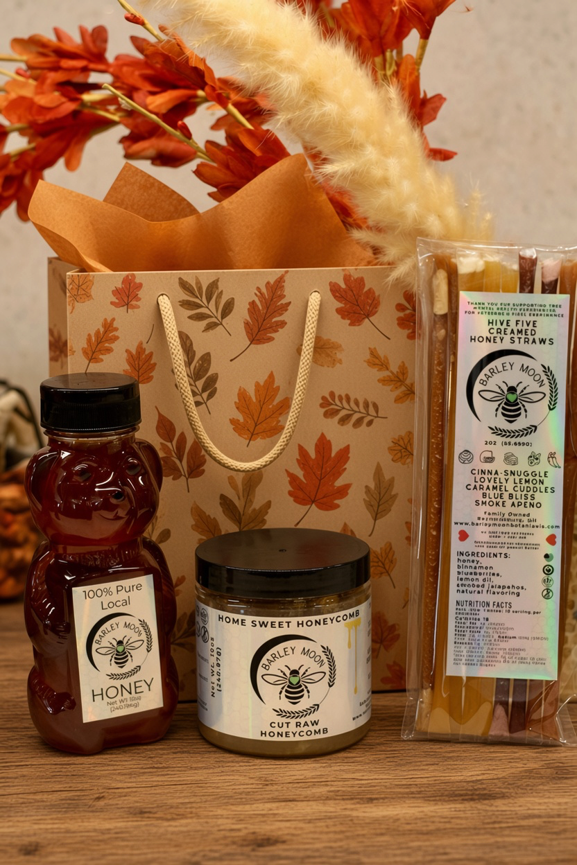 Barley Moon Botanicals raw honey bundle featuring a honey bear, jar of honeycomb, and creamed honey straws in a gift bag
