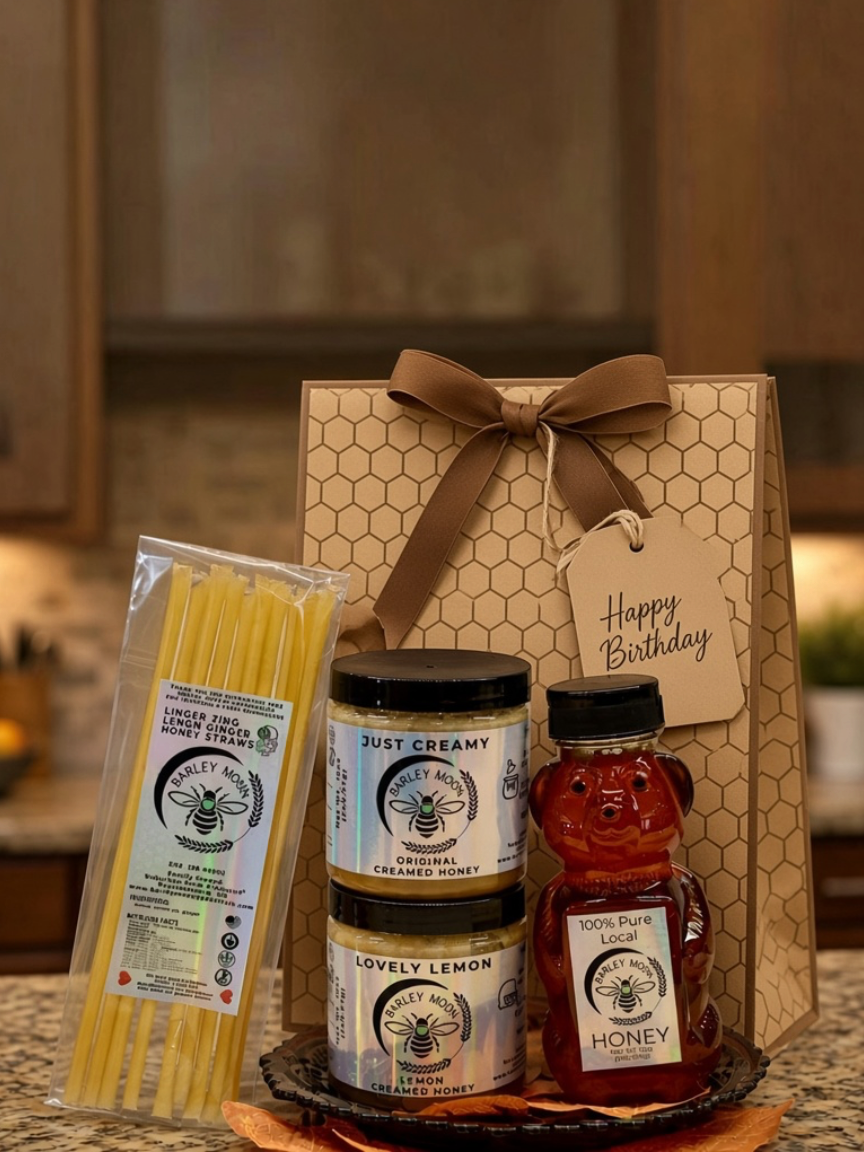 Barley Moon Botanicals Tea Lover Bundle featuring creamed honey jars, a honey bear, and lemon ginger honey straws.