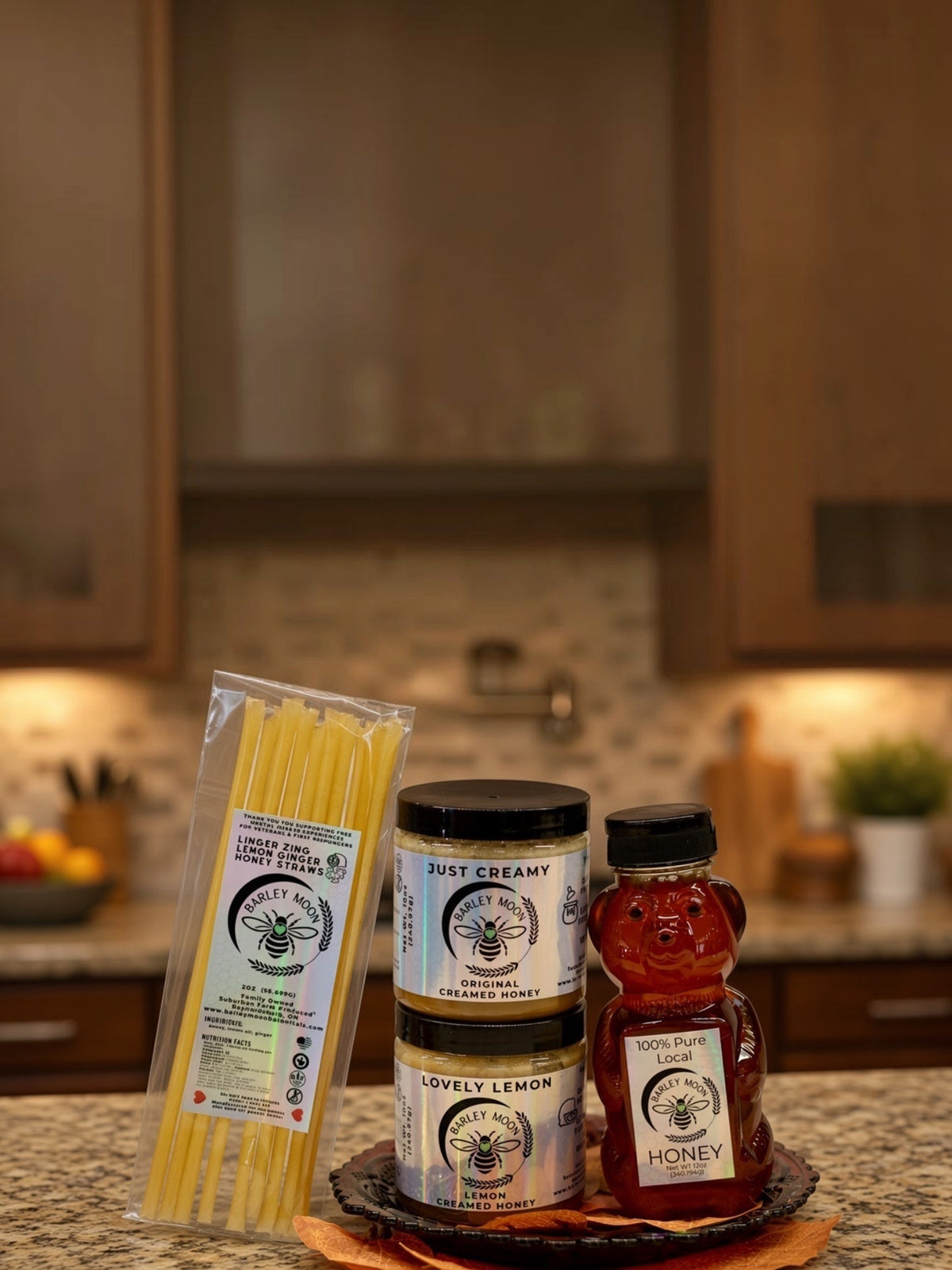 Barley Moon Botanicals tea lover bundle with creamed honey jars, a raw honey bear, and lemon ginger honey straws.